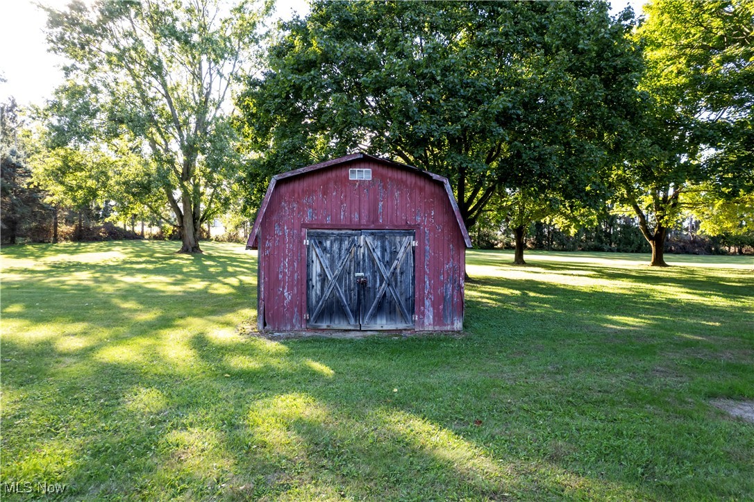 1675 South Funk Road Wooster, OH 44691 - Photo 34 of 34 View of outbuilding featuring a lawn