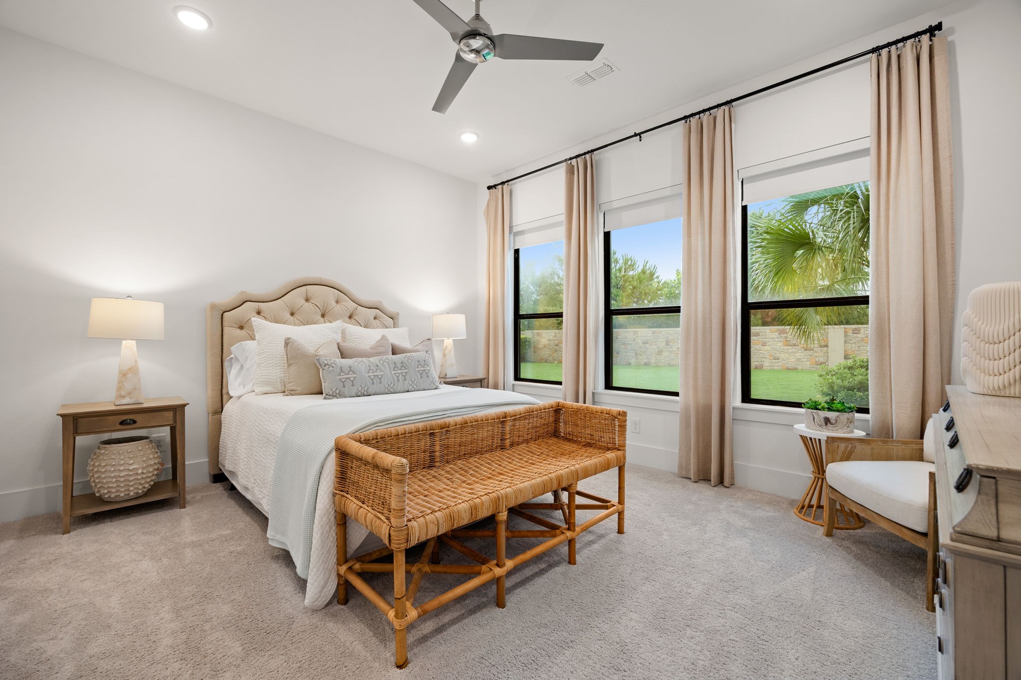 27903 Indigo Ridge Drive Fulshear, TX 77441 - Photo 25 of 50 Comfortable secondary bedroom featuring large windows, soft natural light, and peaceful backyard views.