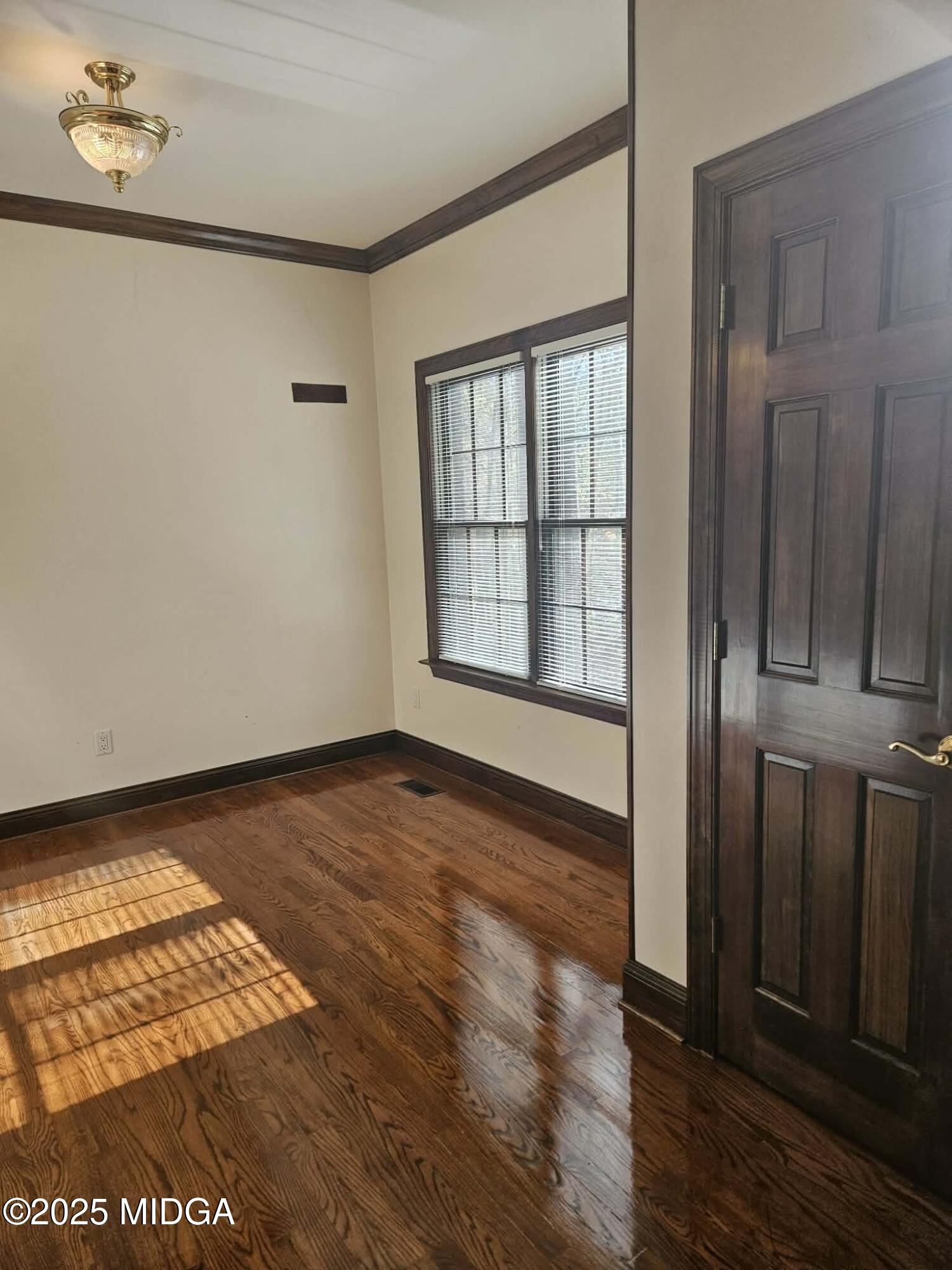 103 Oakview Circle Gray, GA 31032 - Photo 17 of 61 a view of an empty room with wooden floor and a window