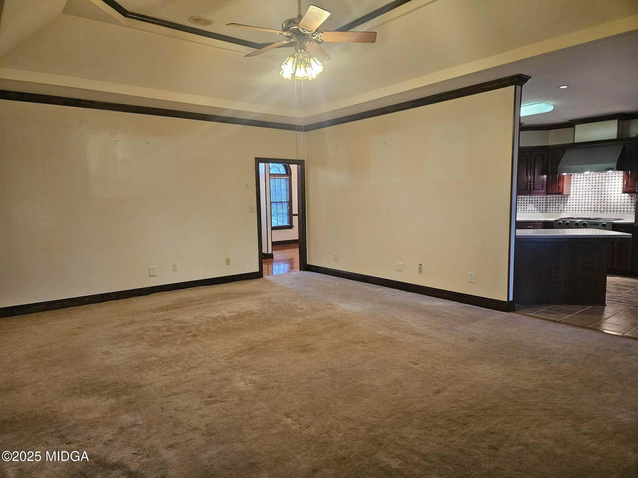 103 Oakview Circle Gray, GA 31032 - Photo 22 of 61 a view of an empty room with kitchen and a window