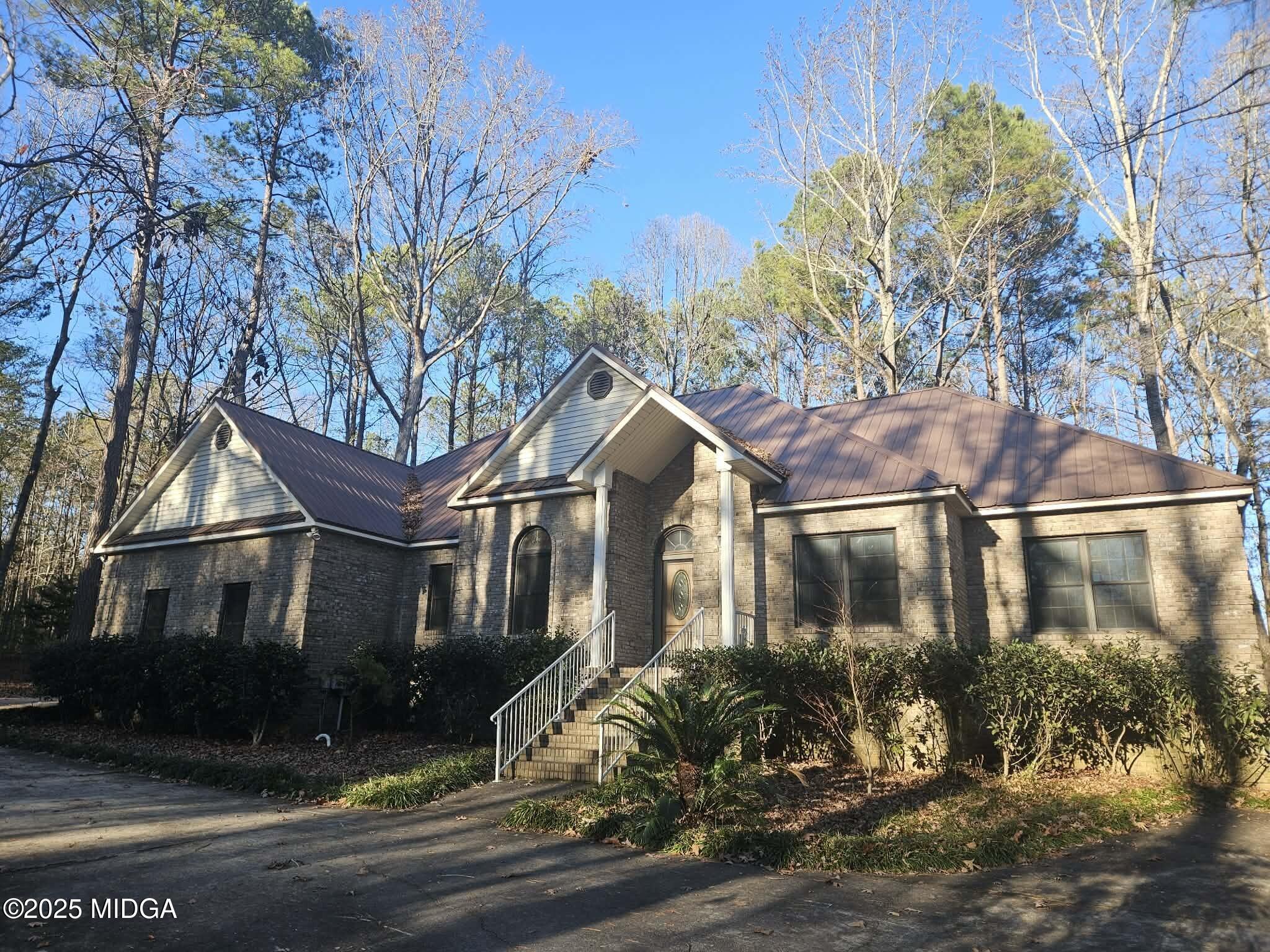103 Oakview Circle Gray, GA 31032 - Photo 3 of 61 a front view of a house with a yard
