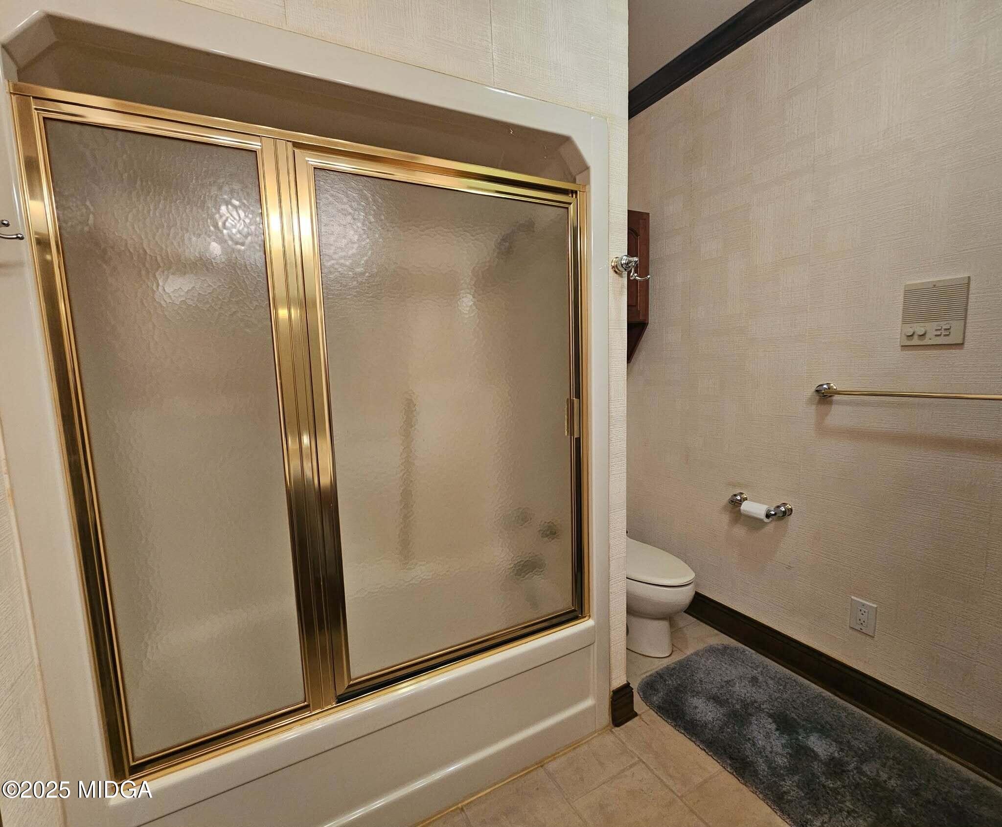 103 Oakview Circle Gray, GA 31032 - Photo 35 of 61 a bathroom with a glass shower door