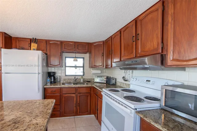 $379,900 | 112 Lake Shore Drive, Pembroke Park, FL 33009