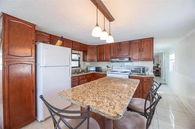$379,900 | 112 Lake Shore Drive, Pembroke Park, FL 33009