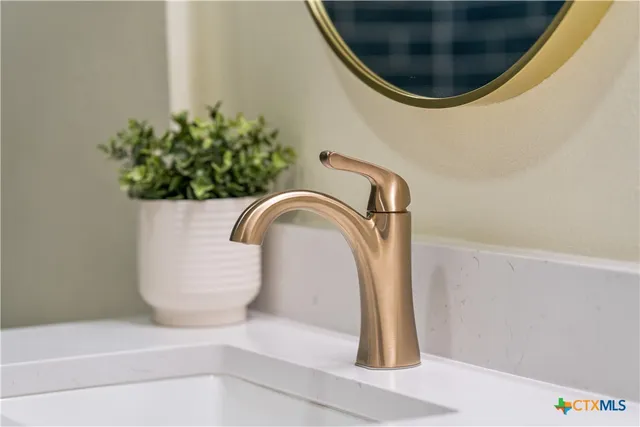 a backyard of a house with large trees and outdoor seating