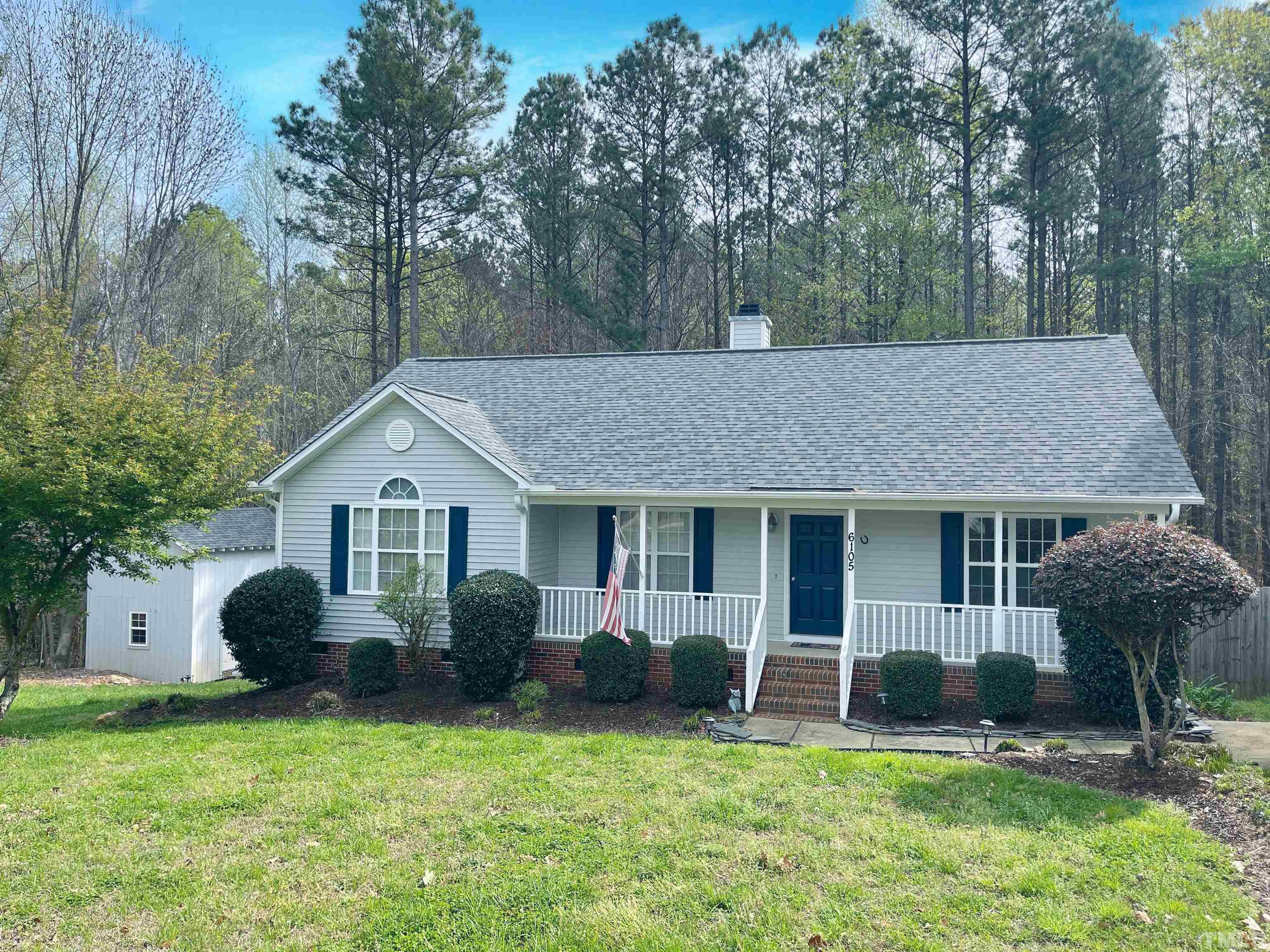 a view of a house with a yard and plants