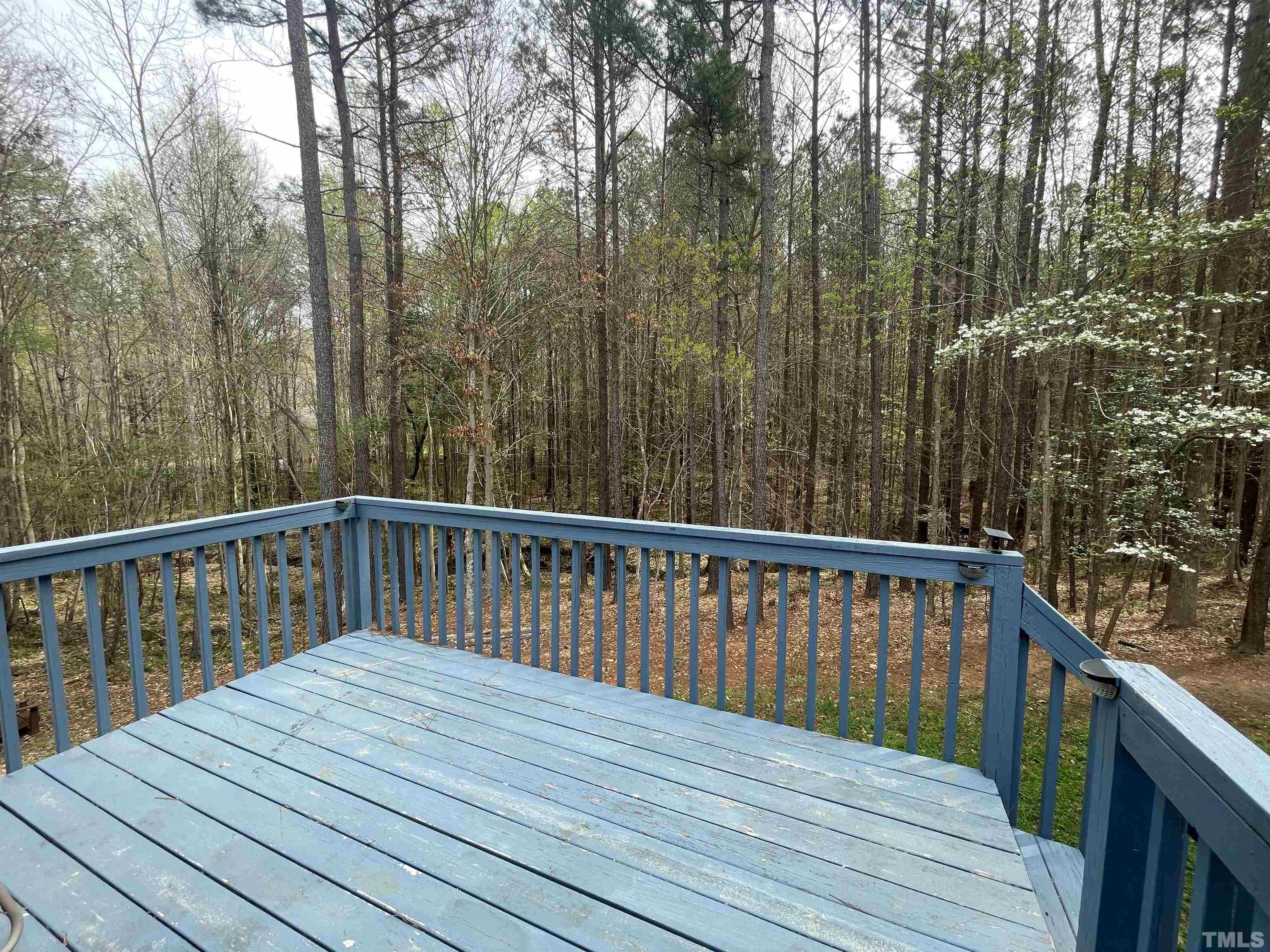 6105 Ruddington Court Willow Spring, NC 27592 - Photo 12 of 18 a balcony with wooden floor and fence