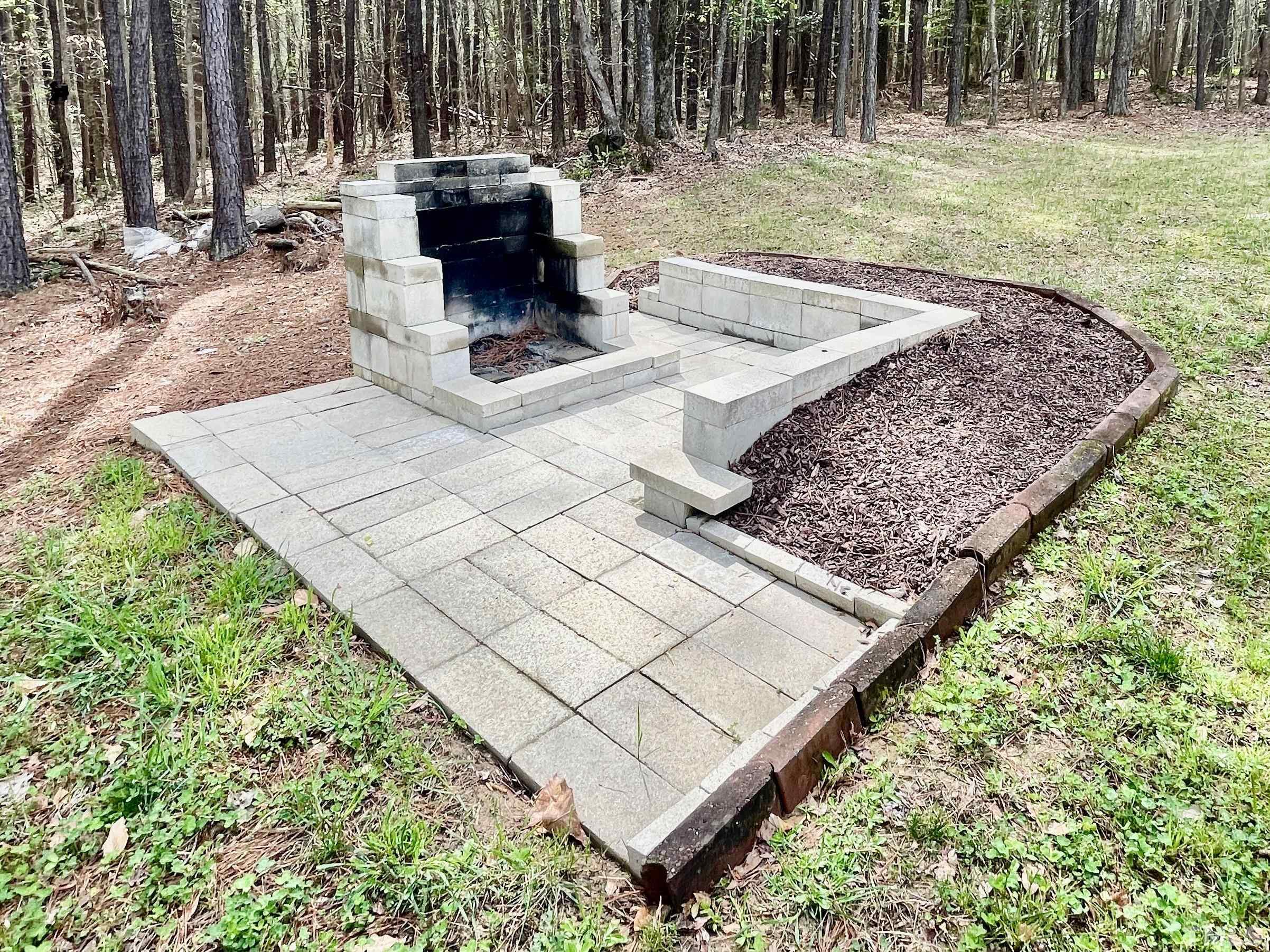 6105 Ruddington Court Willow Spring, NC 27592 - Photo 14 of 18 a wooden bench sitting in the middle of a yard