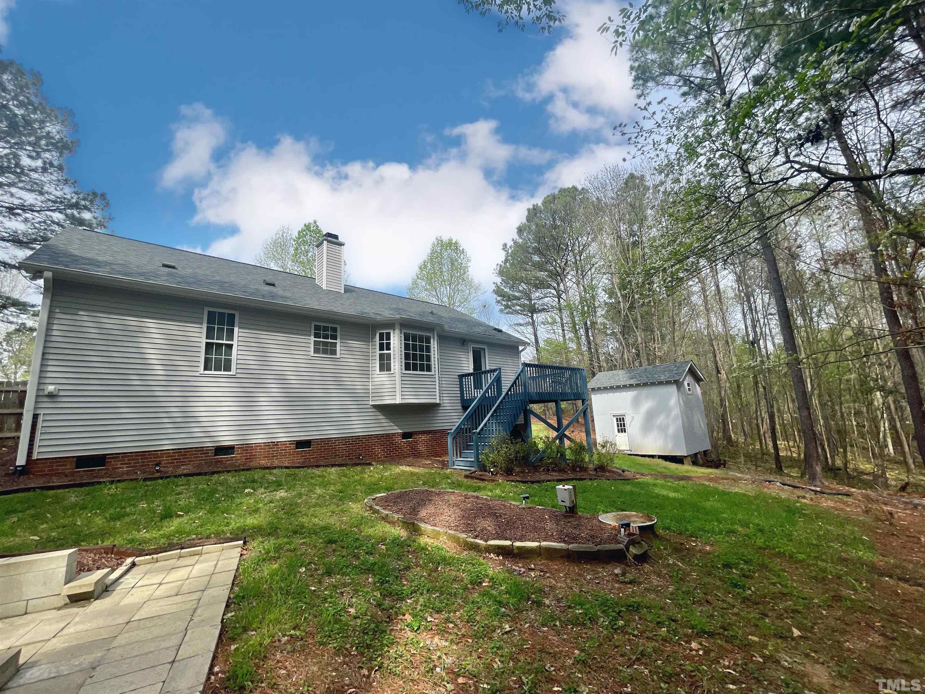 6105 Ruddington Court Willow Spring, NC 27592 - Photo 15 of 18 front view of a house with a yard