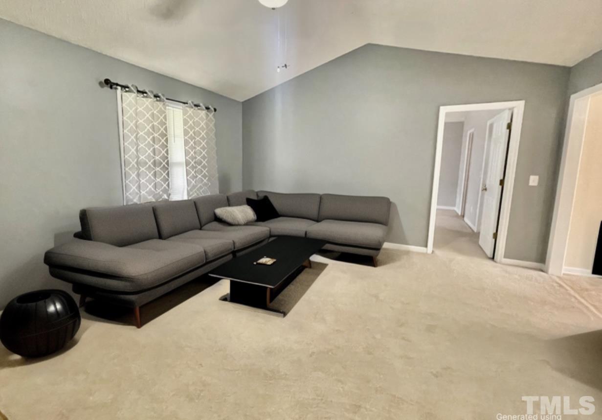 6105 Ruddington Court Willow Spring, NC 27592 - Photo 2 of 18 a living room with furniture and a window