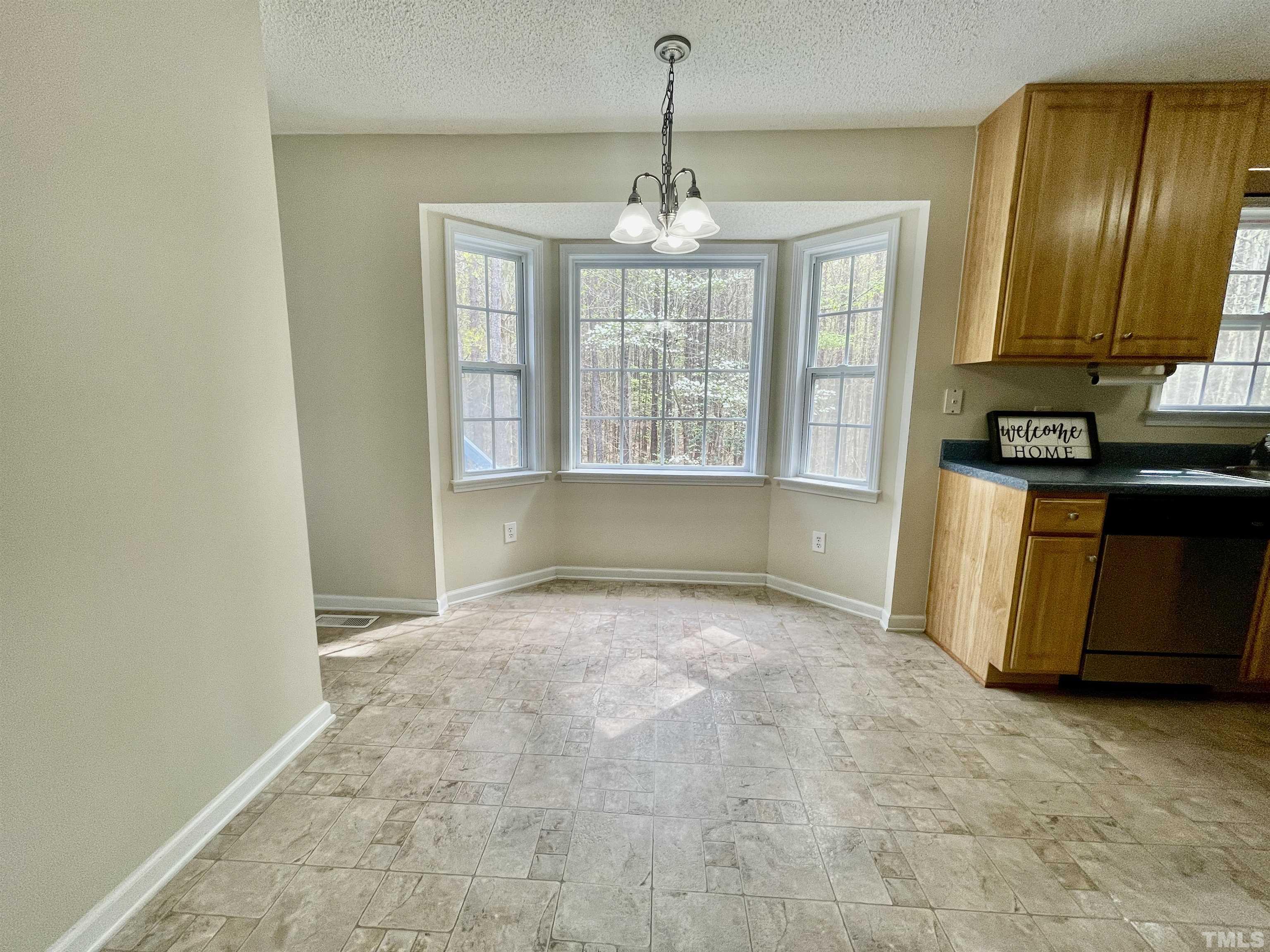 6105 Ruddington Court Willow Spring, NC 27592 - Photo 3 of 18 a view of an empty room with a window
