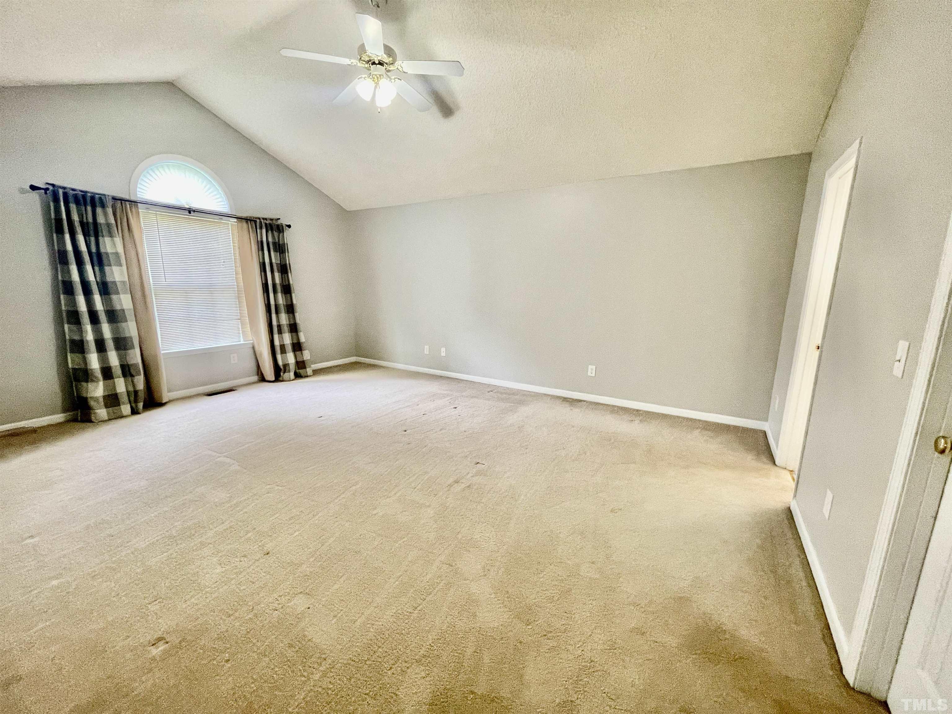6105 Ruddington Court Willow Spring, NC 27592 - Photo 6 of 18 a view of an empty room with a fireplace