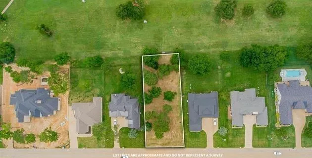 aerial view of a house with a yard