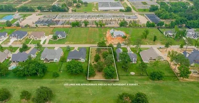 an aerial view of a residential houses with outdoor space and swimming pool