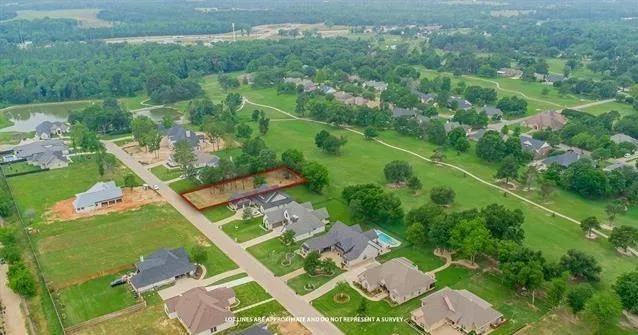 an aerial view of multiple houses with yard