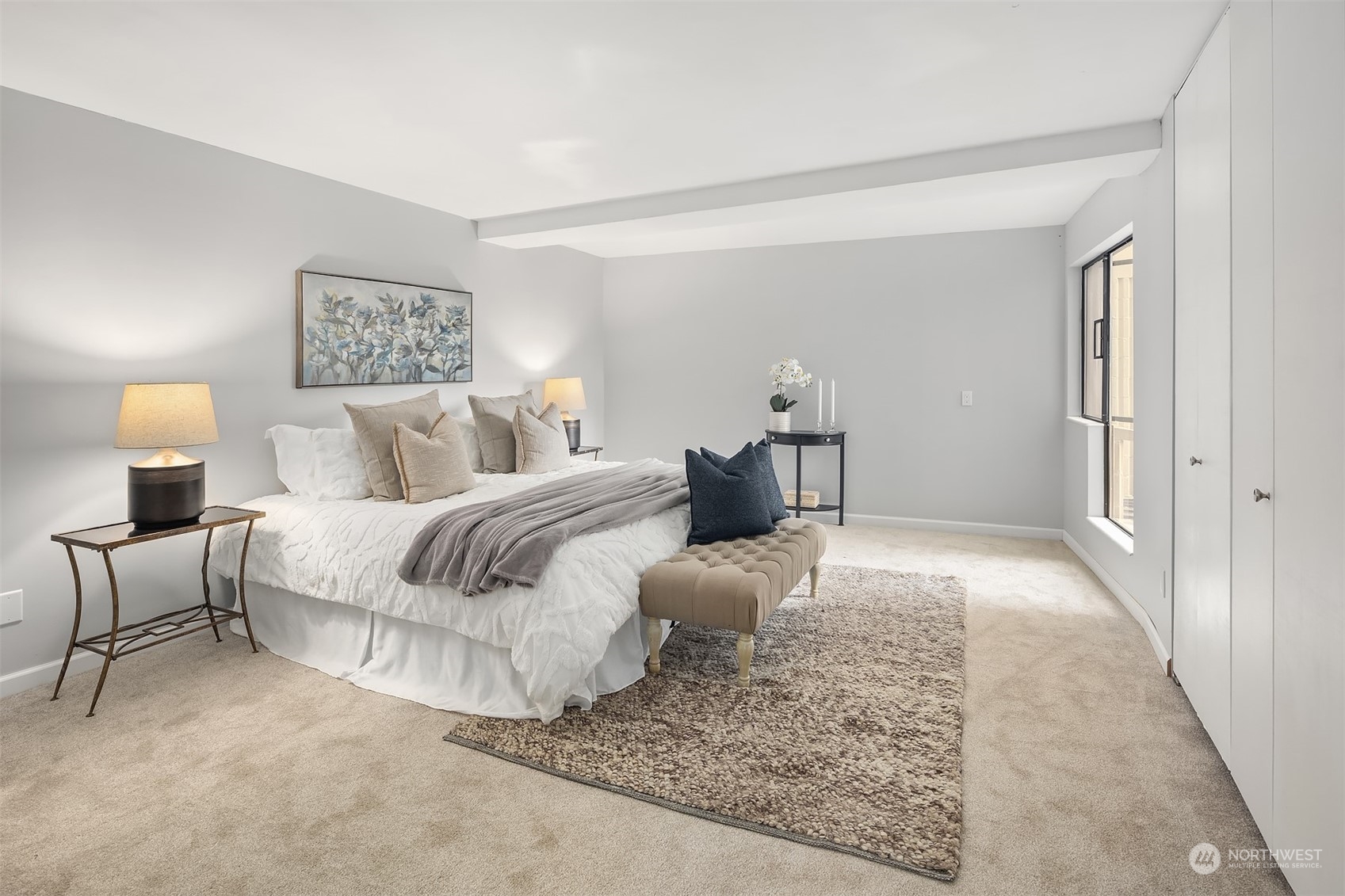 8001 Sand Point Way Northeast, Unit C22 Seattle, WA 98115 - Photo 12 of 27 a bedroom with a bed and a lamp