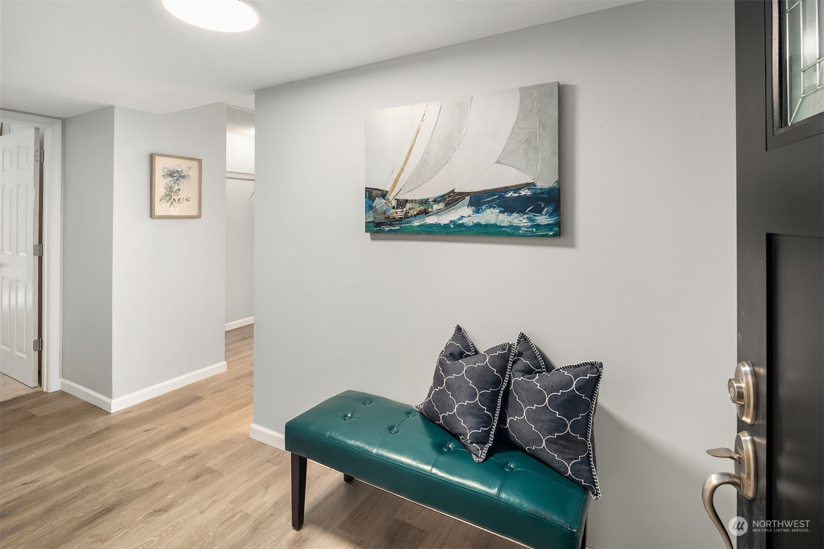 8001 Sand Point Way Northeast, Unit C22 Seattle, WA 98115 - Photo 17 of 27 a living room with furniture and a wooden floor