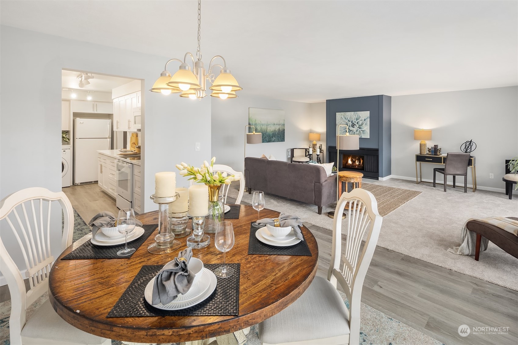 8001 Sand Point Way Northeast, Unit C22 Seattle, WA 98115 - Photo 2 of 27 a dining room with furniture a chandelier and wooden floor