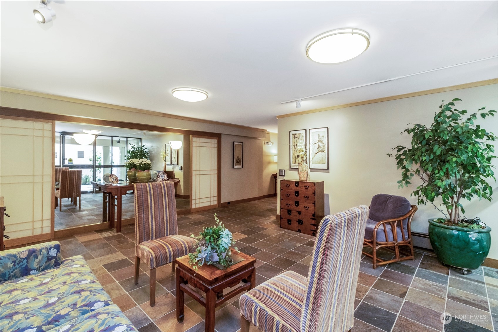 8001 Sand Point Way Northeast, Unit C22 Seattle, WA 98115 - Photo 21 of 27 a living room with furniture potted plant and a window