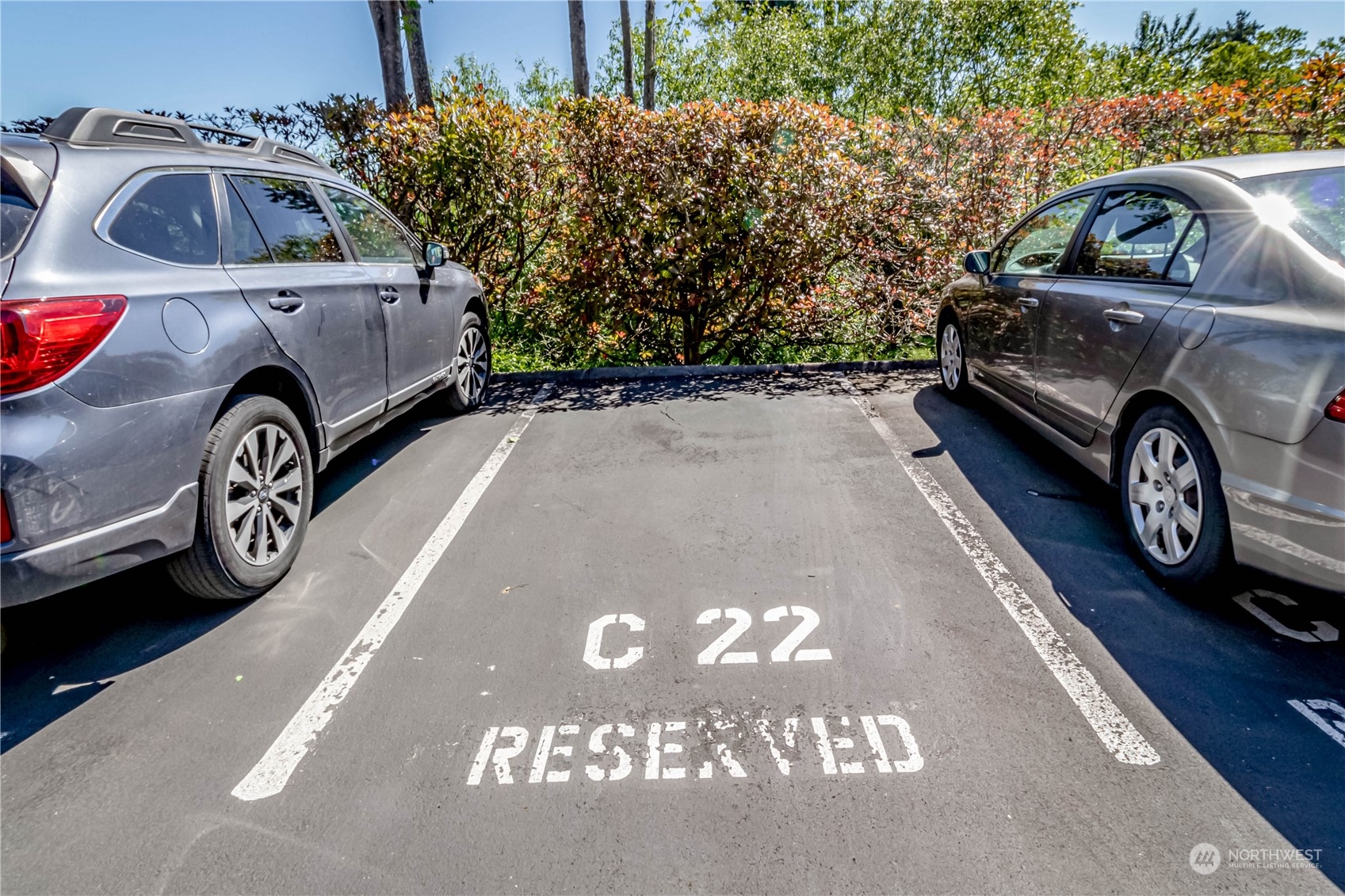 8001 Sand Point Way Northeast, Unit C22 Seattle, WA 98115 - Photo 23 of 27 a car parked in front of a house
