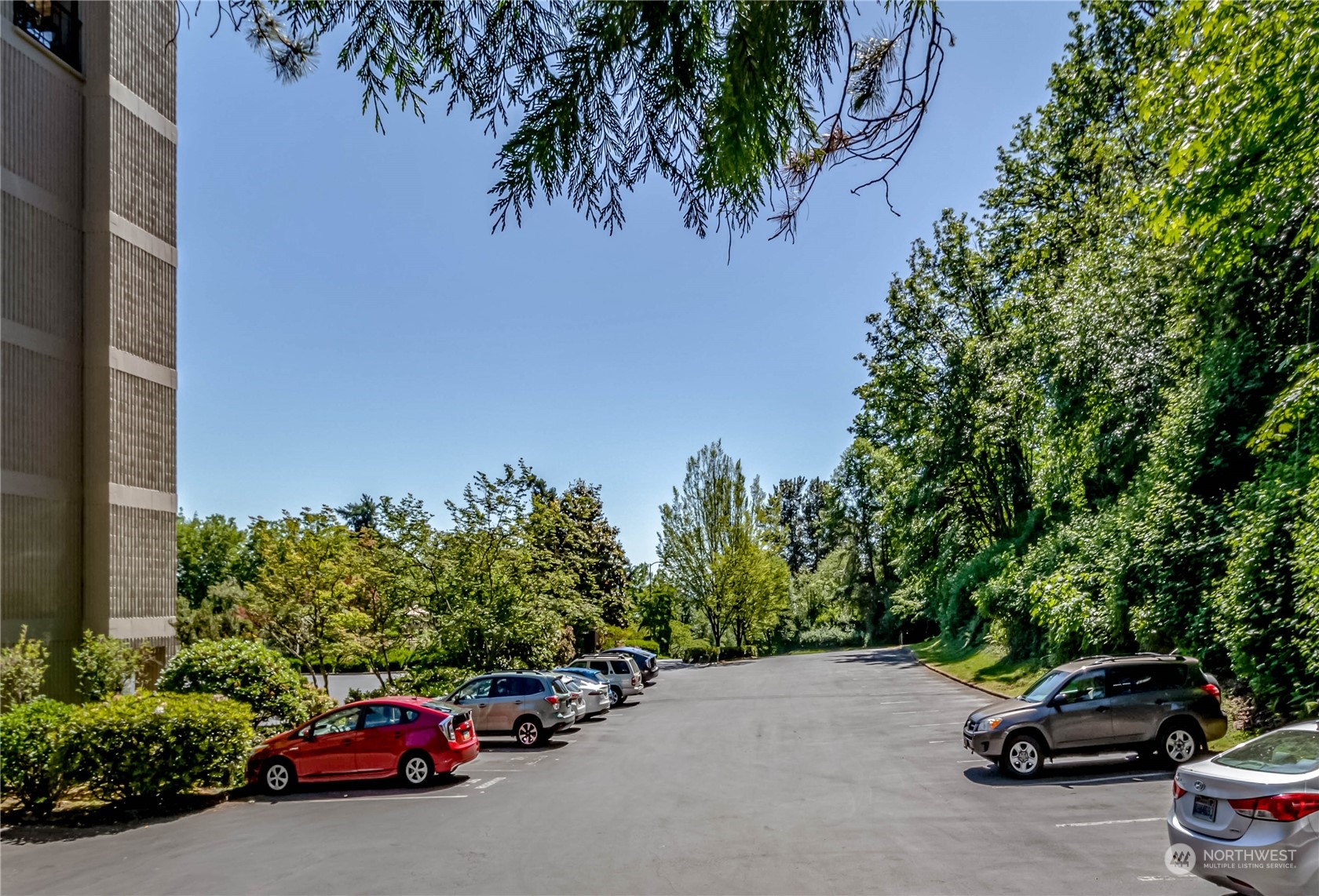 8001 Sand Point Way Northeast, Unit C22 Seattle, WA 98115 - Photo 26 of 27 a car parked on the side of the road