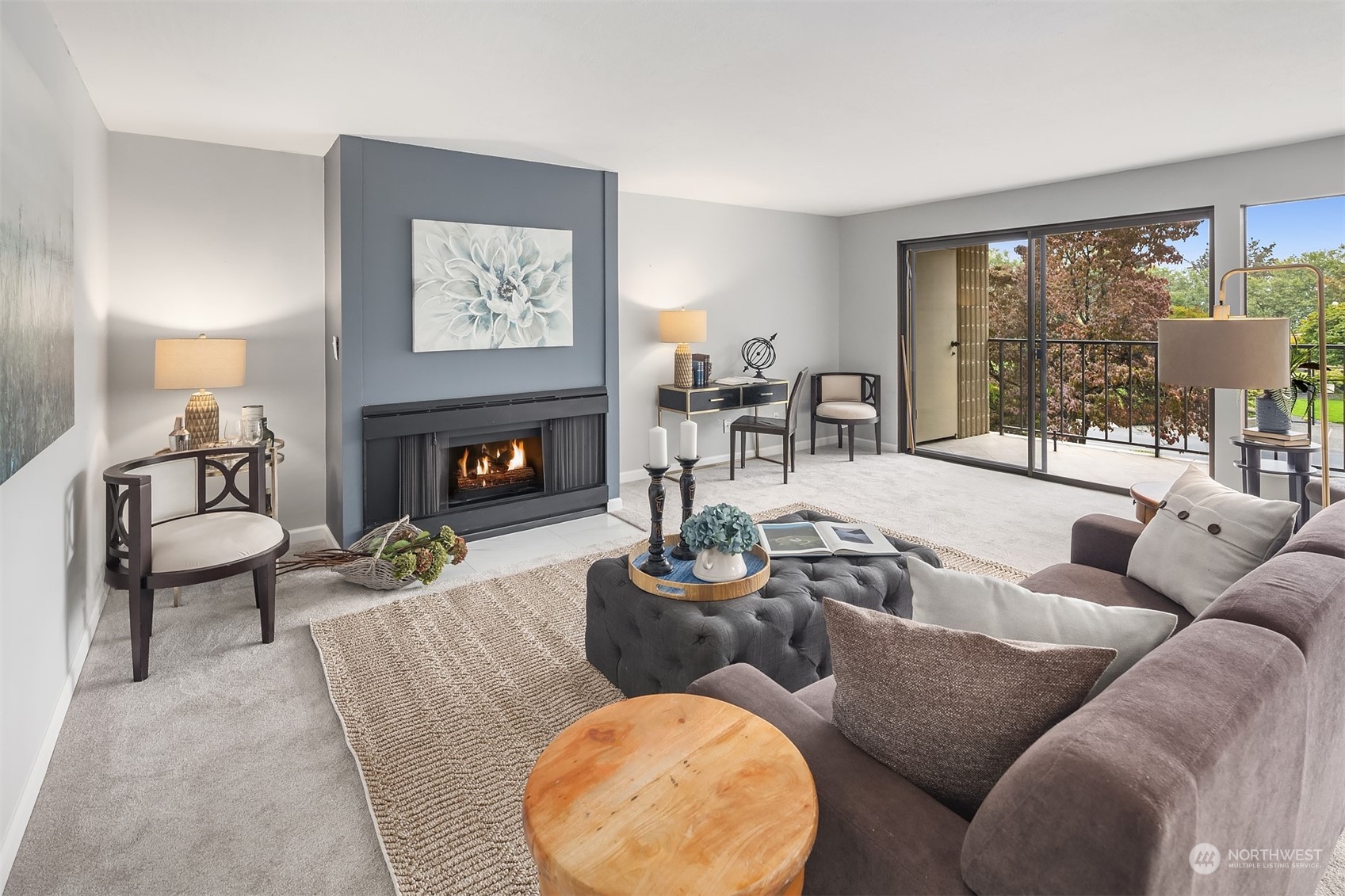 8001 Sand Point Way Northeast, Unit C22 Seattle, WA 98115 - Photo 3 of 27 a living room with furniture fireplace and a large window