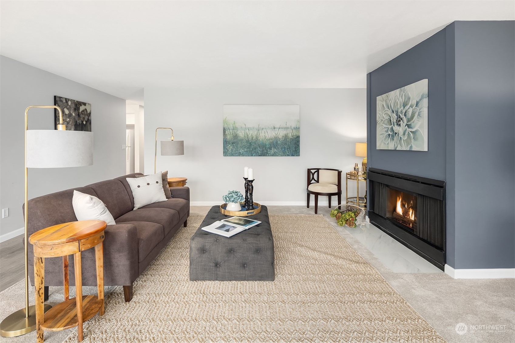 8001 Sand Point Way Northeast, Unit C22 Seattle, WA 98115 - Photo 10 of 27 a living room with furniture and a fireplace