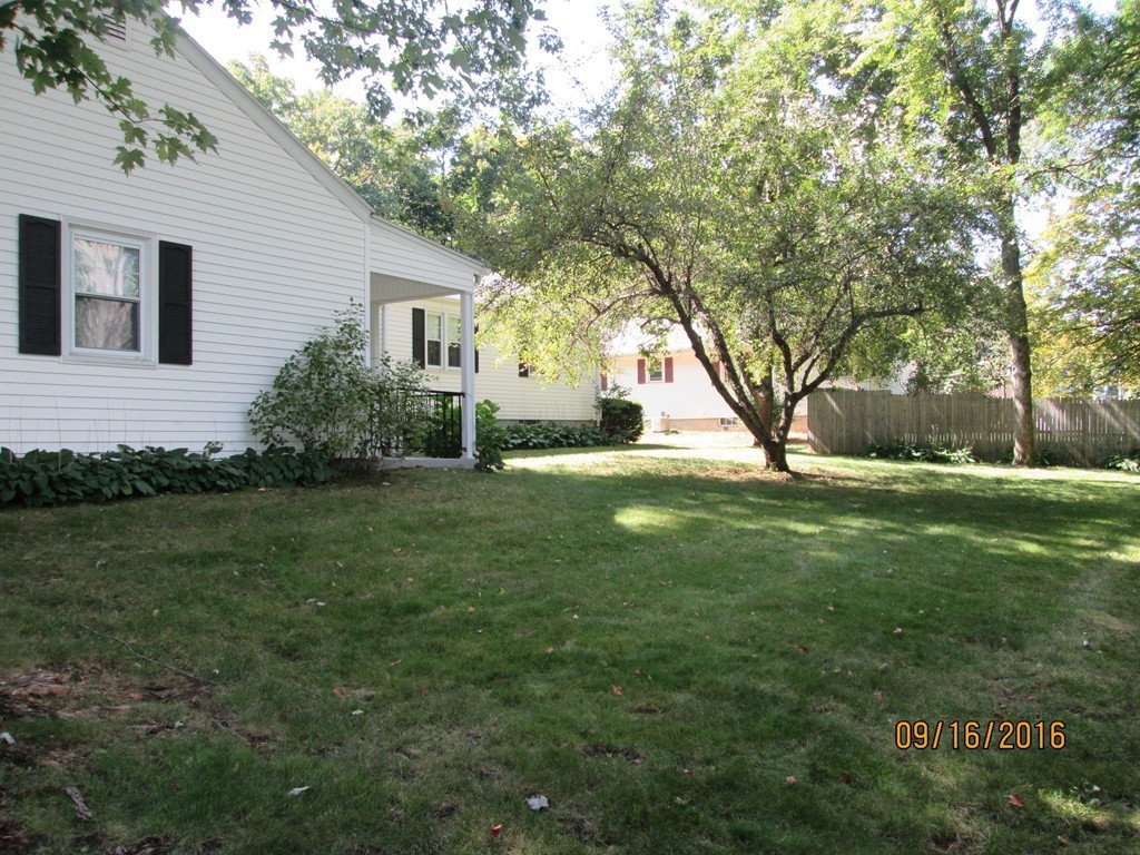 38 Greaney Street Springfield, MA 01104 - Photo 23 of 25 a view of a house with a backyard