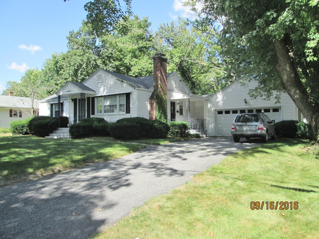 38 Greaney Street Springfield, MA 01104 - Photo 3 of 25 a house view with a garden space