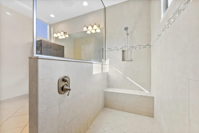 a bathroom with a bathtub and shower