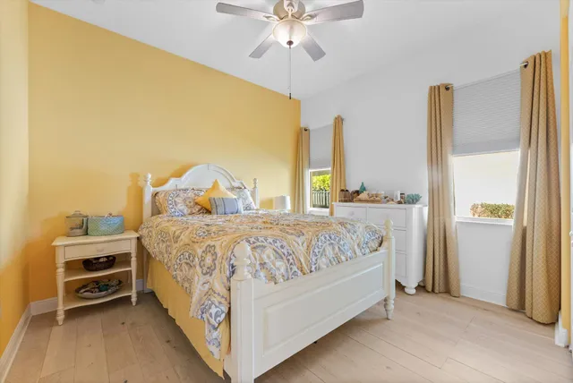 a bedroom with a bed next to a window with outer view