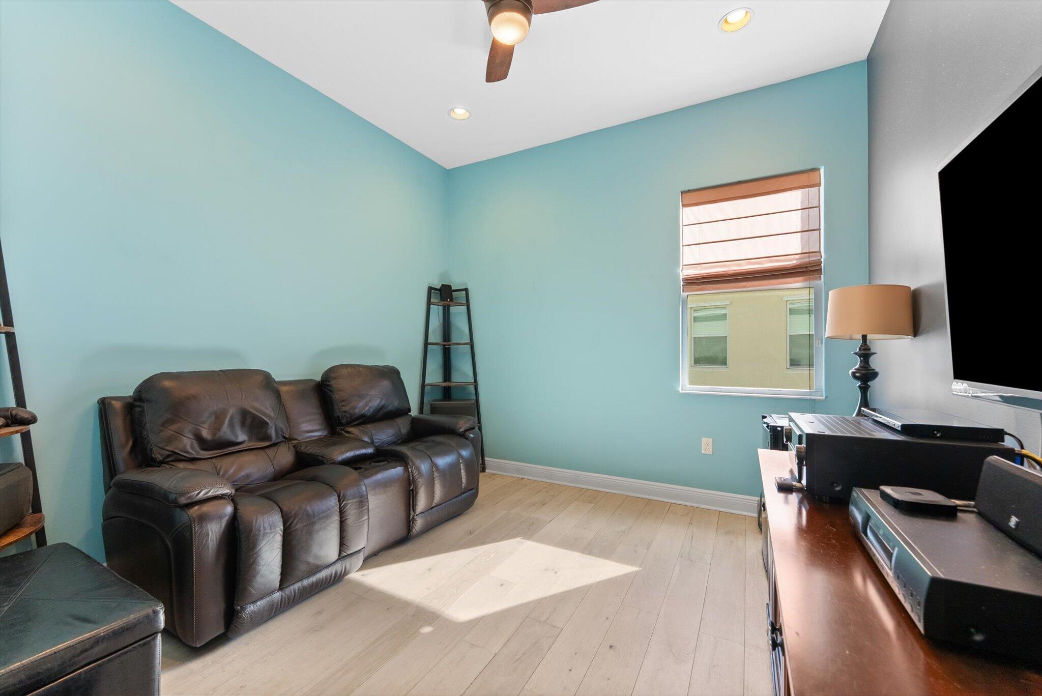 2930 Bellarosa Circle Royal Palm Beach, FL 33411 - Photo 21 of 36 a living room with furniture and a flat screen tv