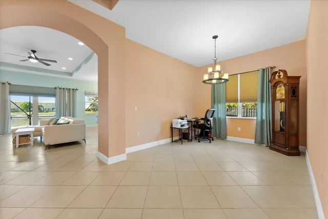a view of a livingroom with furniture and a chandelier