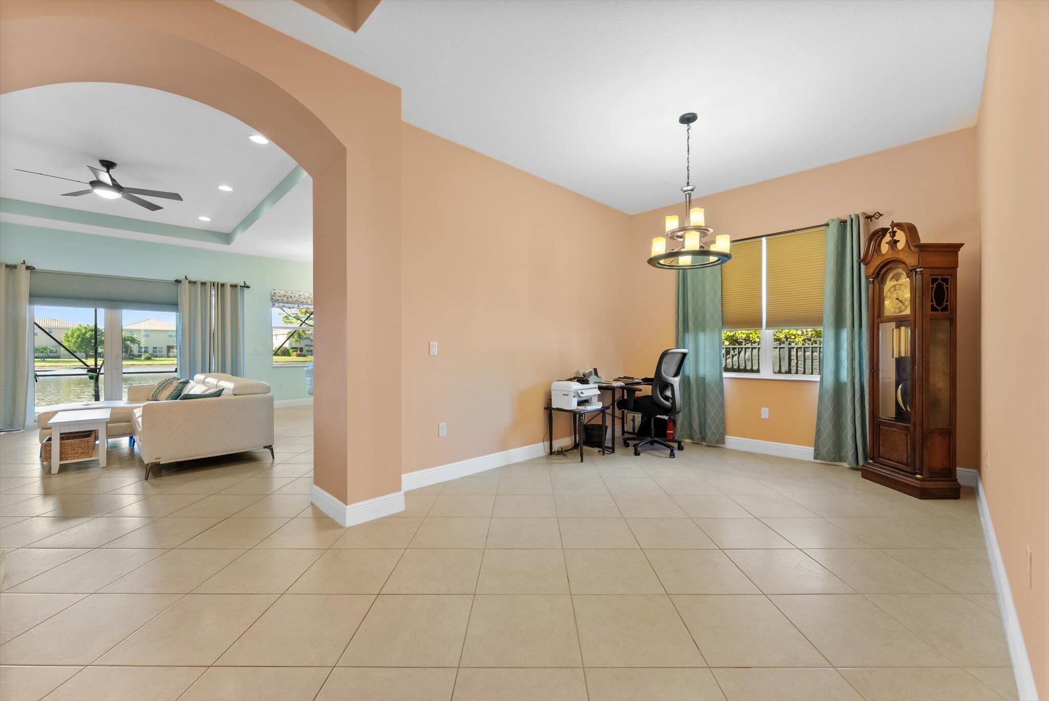 2930 Bellarosa Circle Royal Palm Beach, FL 33411 - Photo 23 of 36 a view of a livingroom with furniture and a chandelier