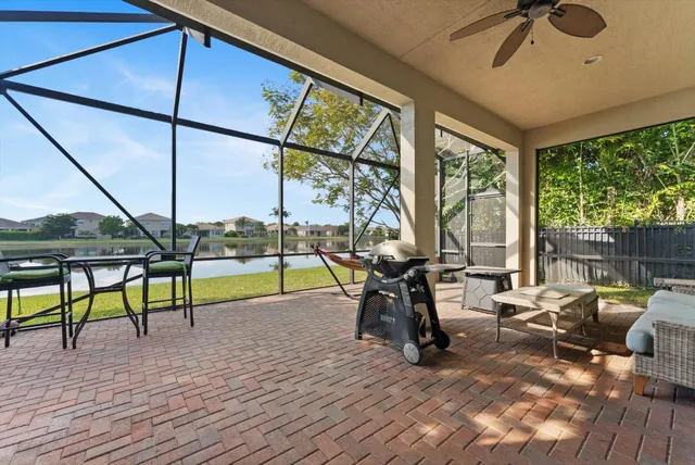 a view of living room with patio furniture and a wooden floor
