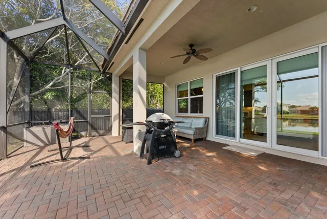 a lobby with furniture and floor to ceiling window
