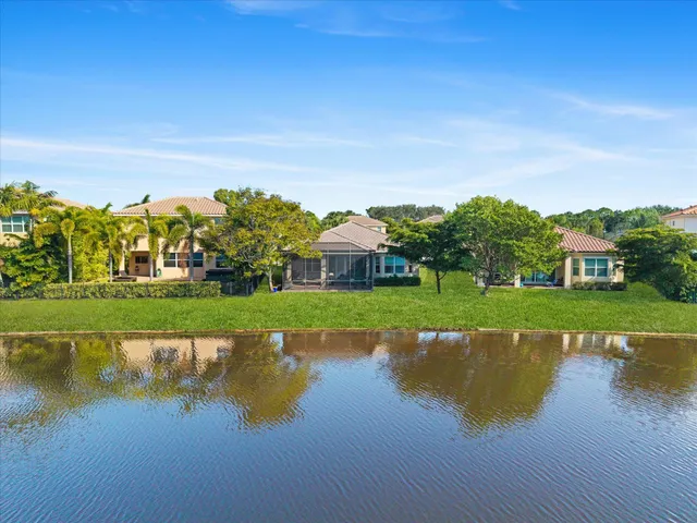an aerial view of a house with a lake view