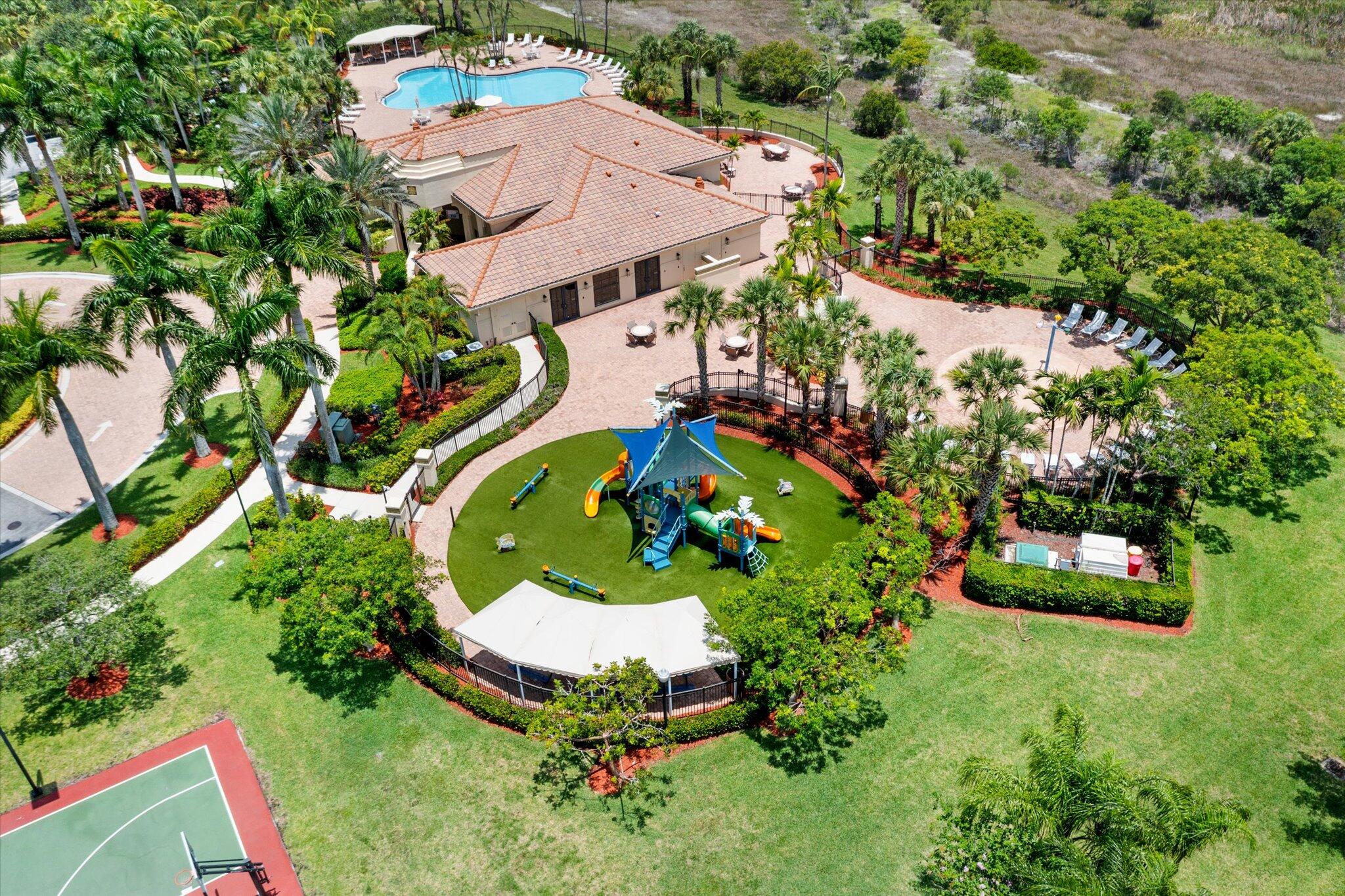 2930 Bellarosa Circle Royal Palm Beach, FL 33411 - Photo 31 of 36 an aerial view of a house with a garden and swimming pool