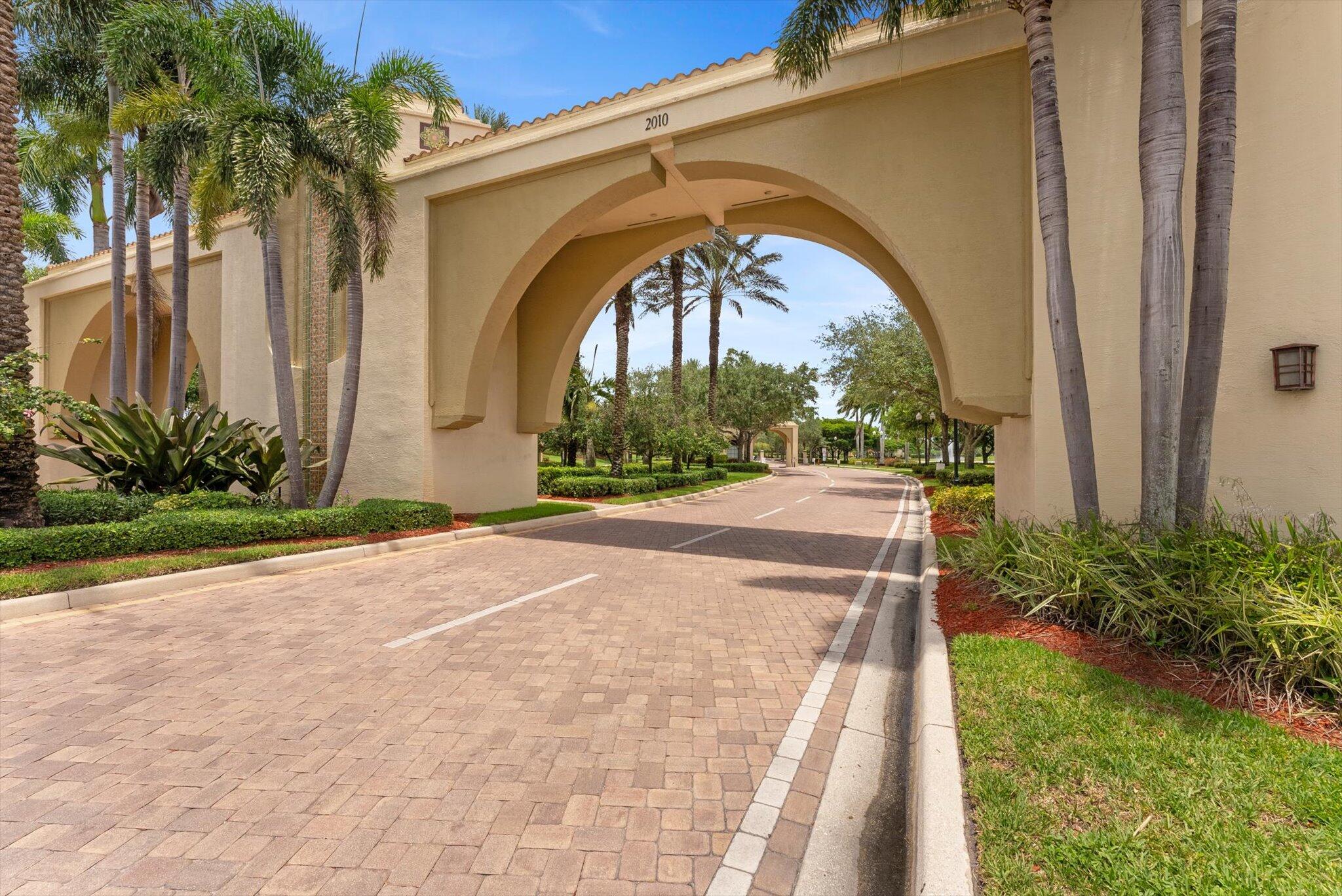 2930 Bellarosa Circle Royal Palm Beach, FL 33411 - Photo 34 of 36 a view of a garden with a swimming pool