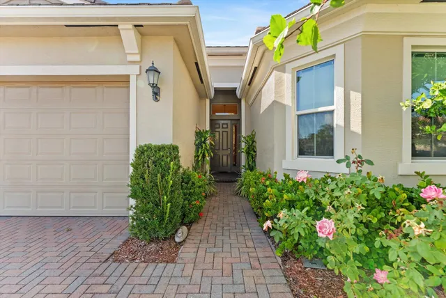 a view of house with flower pots