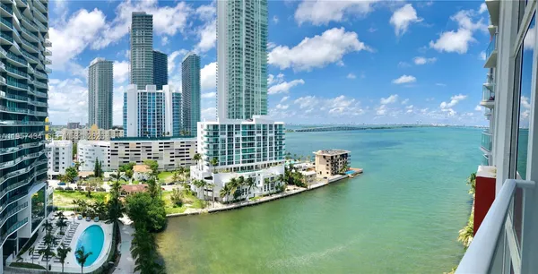 a view of a lake with a big yard