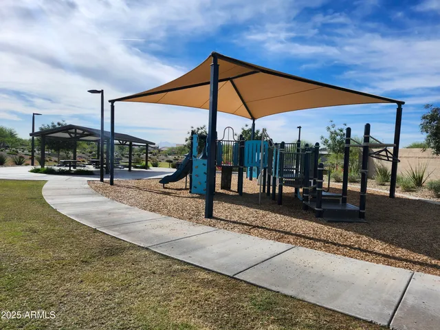 a view of a swimming pool with a patio