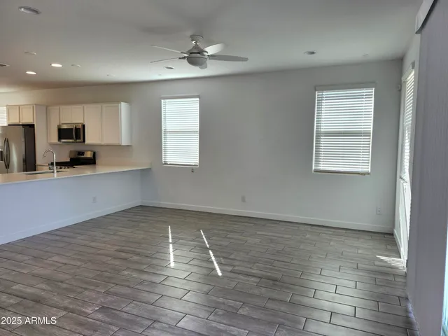 a view of a kitchen with a sink and a window