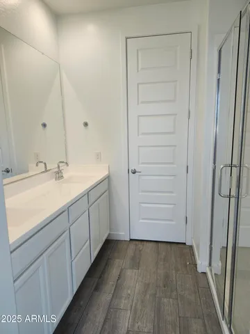 a bathroom with a sink and a mirror