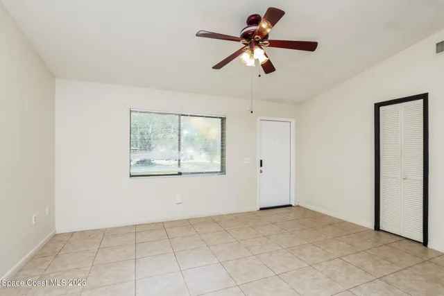 a view of an empty room with a window