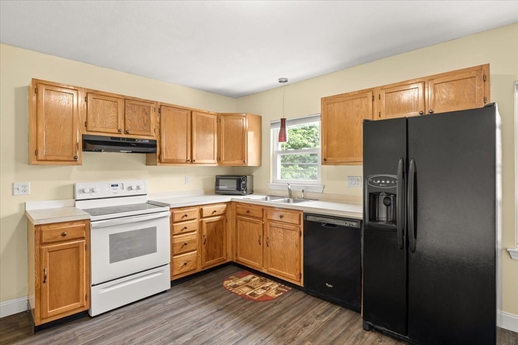 35 Hazel Street, Unit B Attleboro, MA 02703 - Photo 7 of 21 a kitchen with a sink stove and refrigerator
