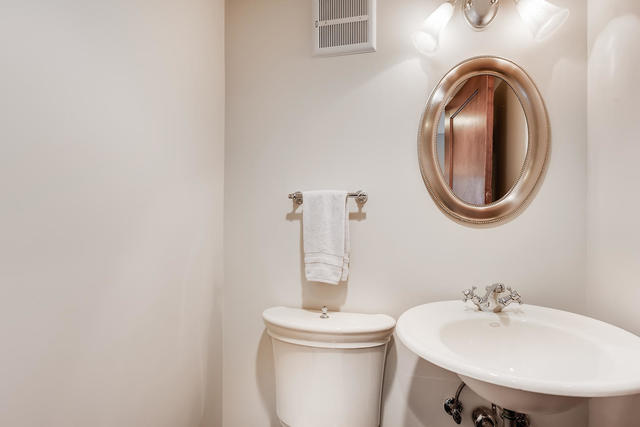 178 Nuttall Road Riverside, IL 60546 - Photo 22 of 49 a bathroom with a sink and a mirror