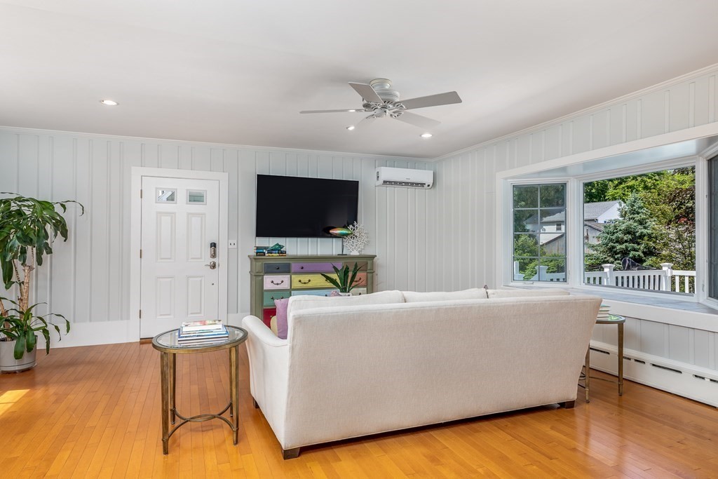 3 Lattimer Street Marblehead, MA 01945 - Photo 22 of 42 a living room with furniture and a flat screen tv