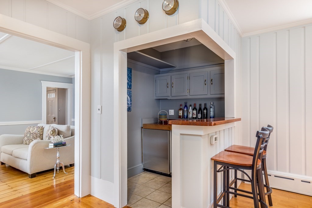 3 Lattimer Street Marblehead, MA 01945 - Photo 23 of 42 a kitchen with stainless steel appliances a stove a table and chairs
