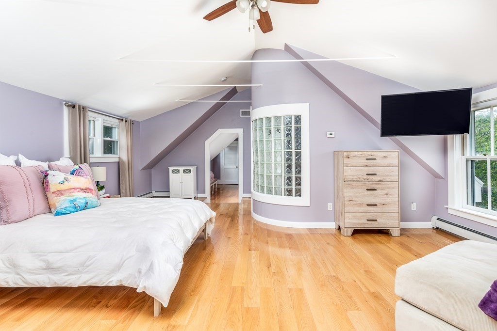3 Lattimer Street Marblehead, MA 01945 - Photo 31 of 42 a spacious bedroom with a bed a window and dresser
